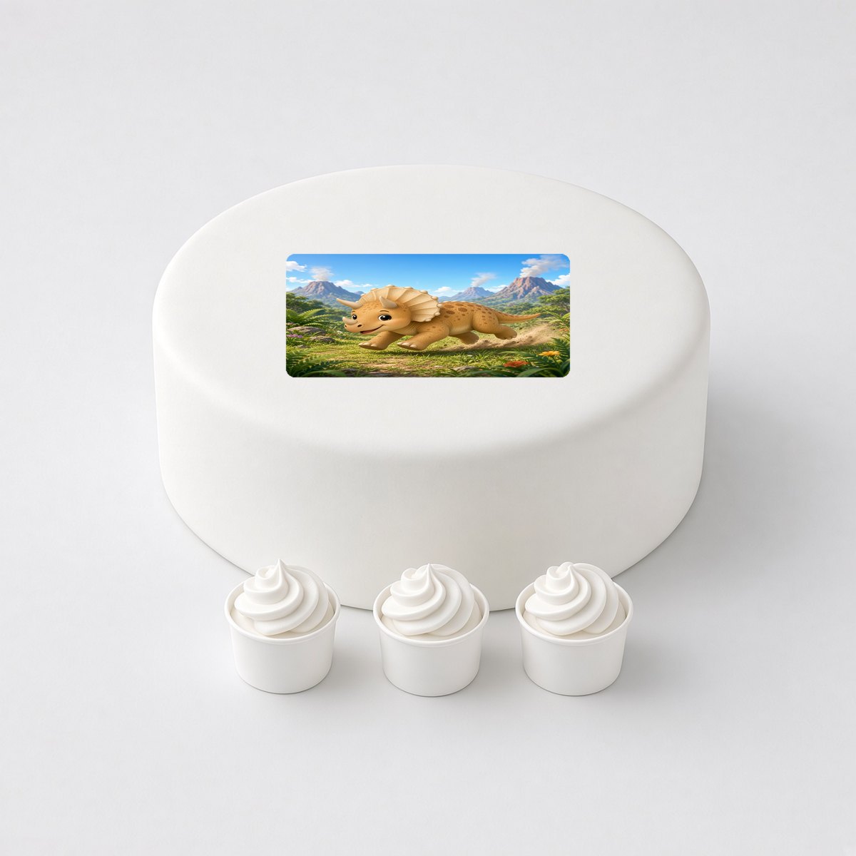 Triceratops in a cartoon scene, printed on a square cake topper on a white cake, with the words your text here above and below.
